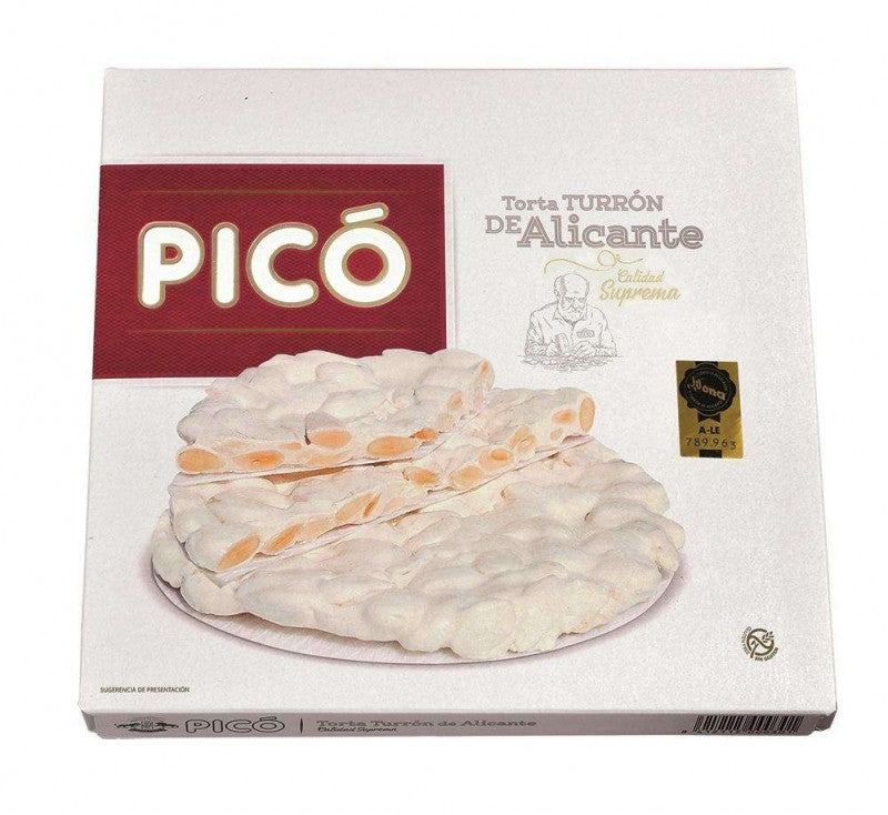 Descubre la auténtica esencia de Alicante con nuestra Torta de Turrón de Alicante de 200 gramos, cortesía de la prestigiosa marca PICÓ. Esta torta es la encarnación perfecta de la tradición culinaria de la región, elaborada con almendras tostadas y miel pura en una presentación que te sorprenderá.